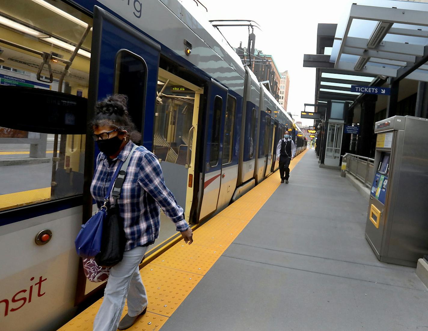 Commuters disembark from a light rail train at the Nicollet Mall station during the morning rush hour Tuesday, June 23, 2020, in Minneapolis, MN.]