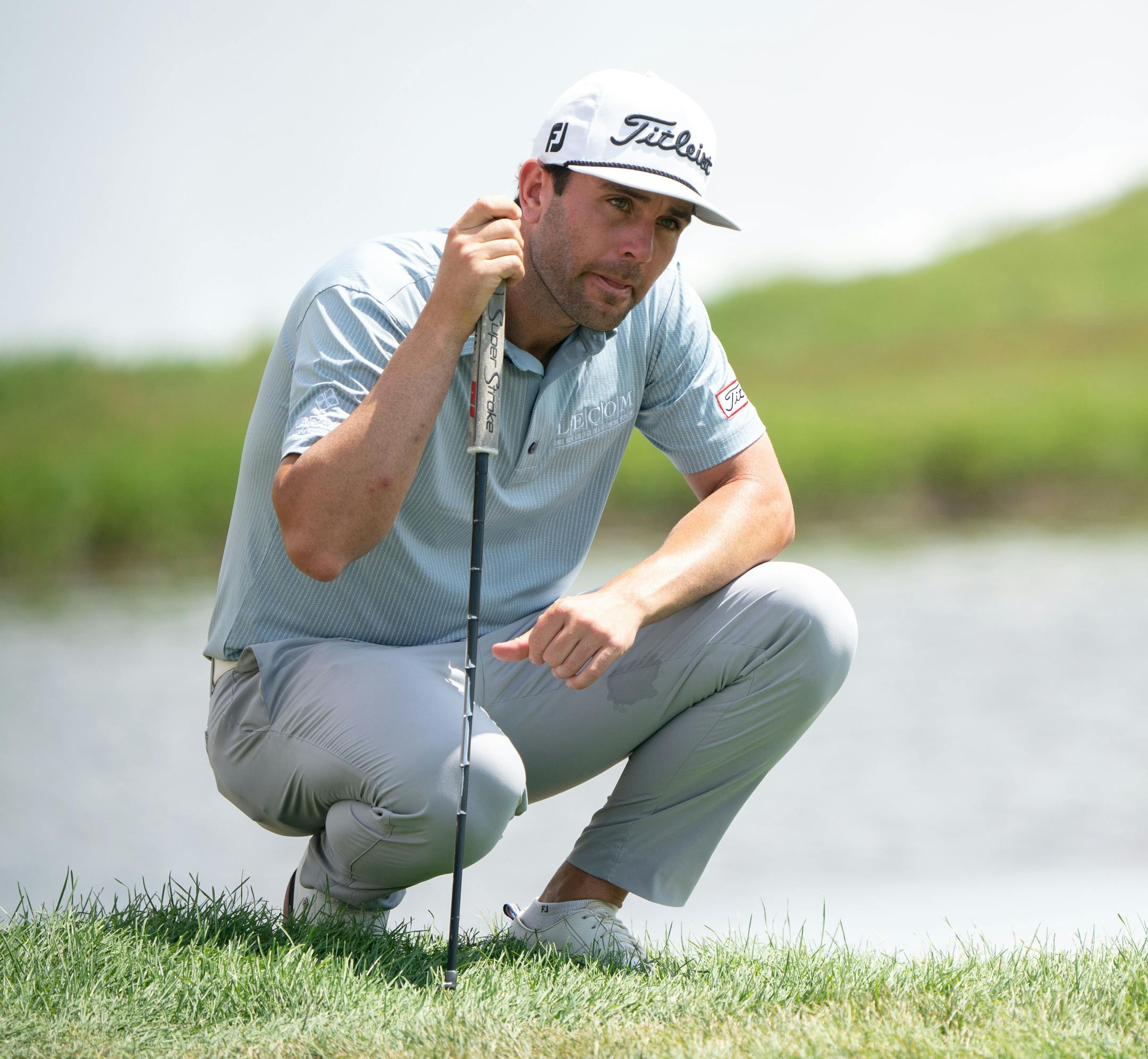 Callum Tarren watches the players in his pairing on the 18th hole during the 3M Open.