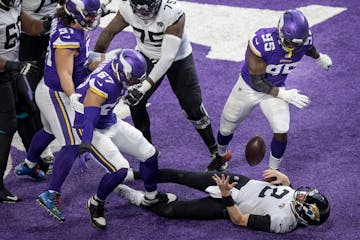 Jacksonville Jaguars quarterback Mike Glennon (2) fumble the ball in the end zone after his was sacked for a safety by Minnesota Vikings defensive end