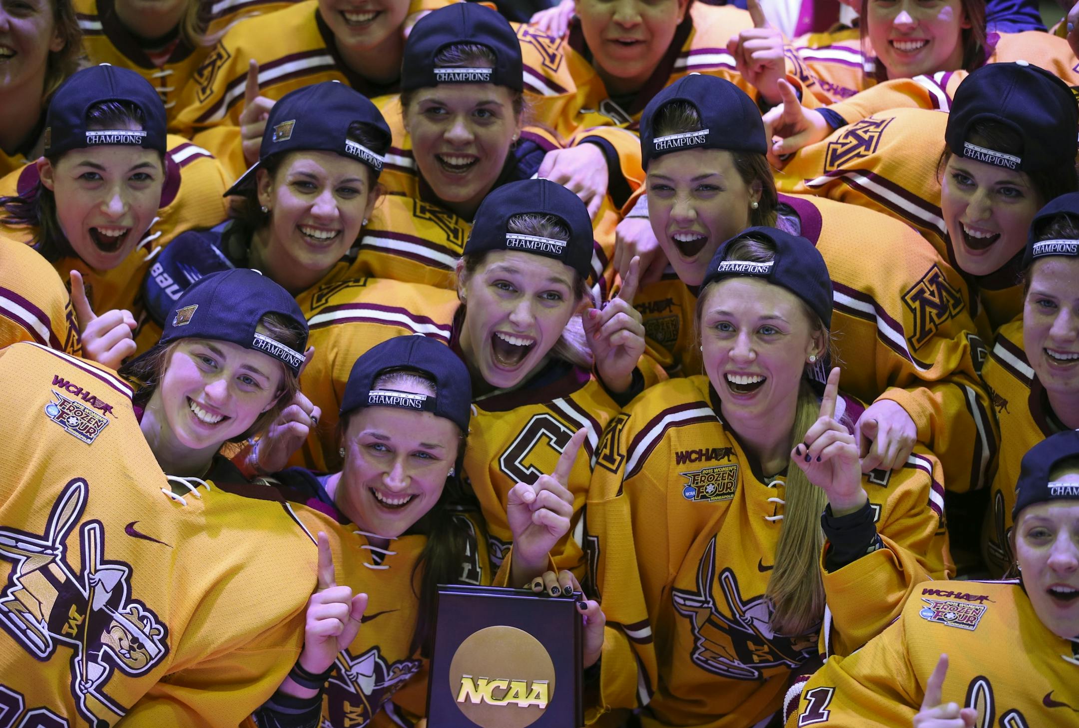 The Gophers posed for a group photo after they received the national championship trophy Sunday afternoon at Ridder Arena.