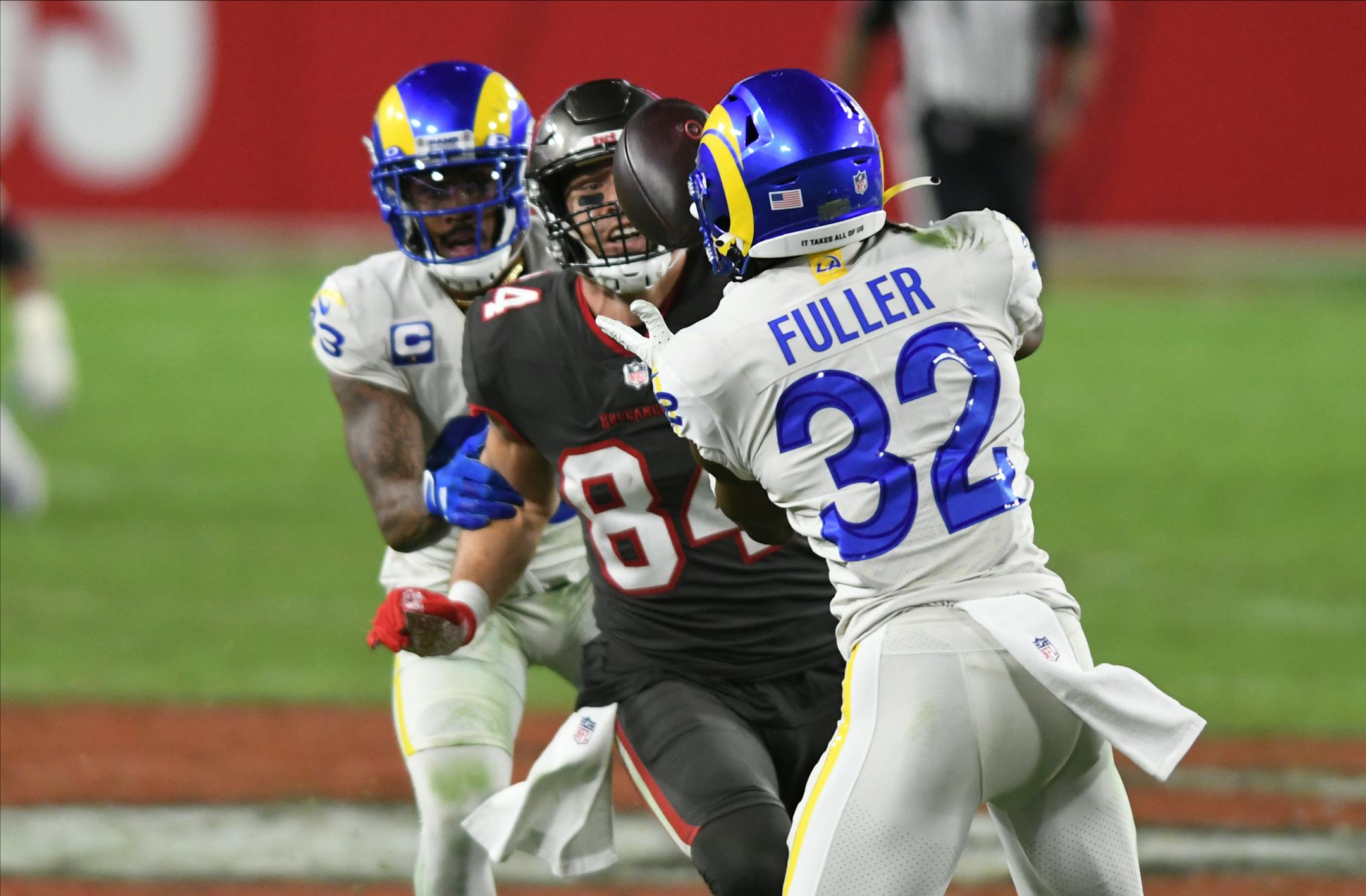 Rams strong safety Jordan Fuller (32) intercepted a pass intended for Buccaneers tight end Cameron Brate (84) during the second half Monday night.