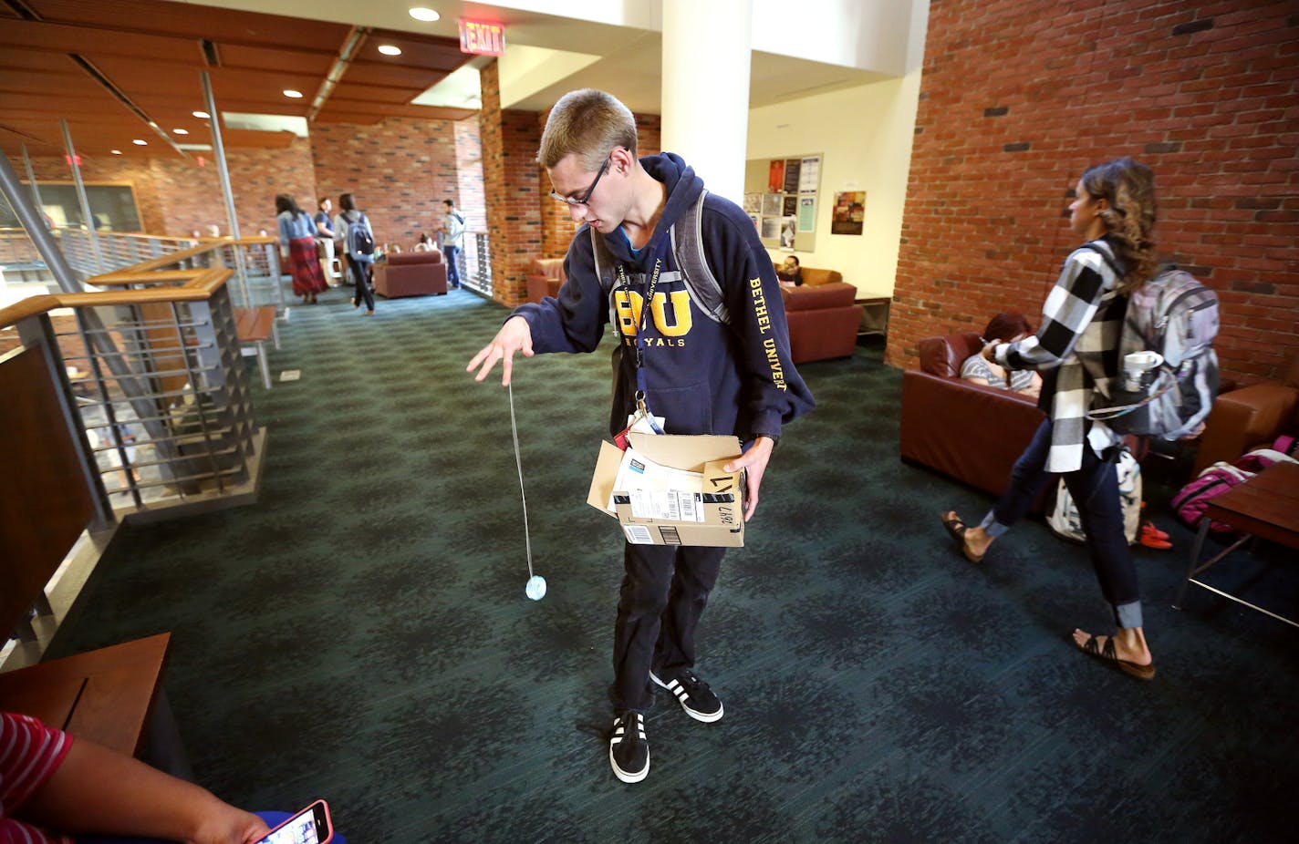 Bethel University Inclusive Learning and Development (BUILD) student Sam Kohs, 22, of Forest Lake played with a yo-yo he had just received in the mail from his father.