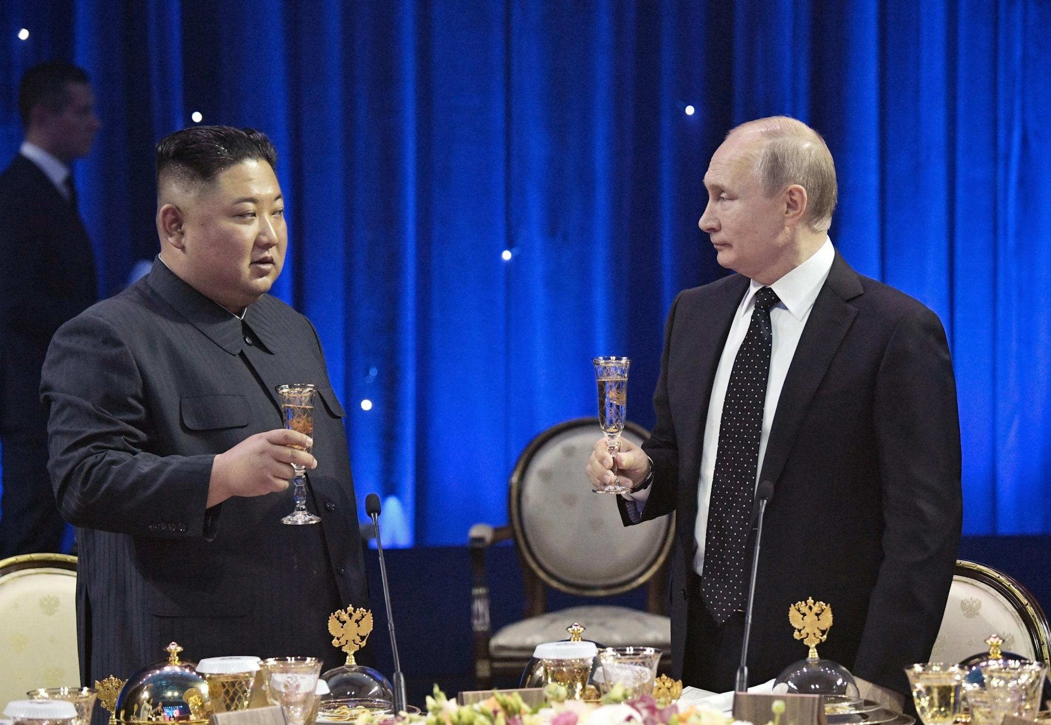 Russian President Vladimir Putin, right, toasts with North Korea's leader Kim Jong Un after their talks in Vladivostok, Russia, Thursday, April 25, 2019.