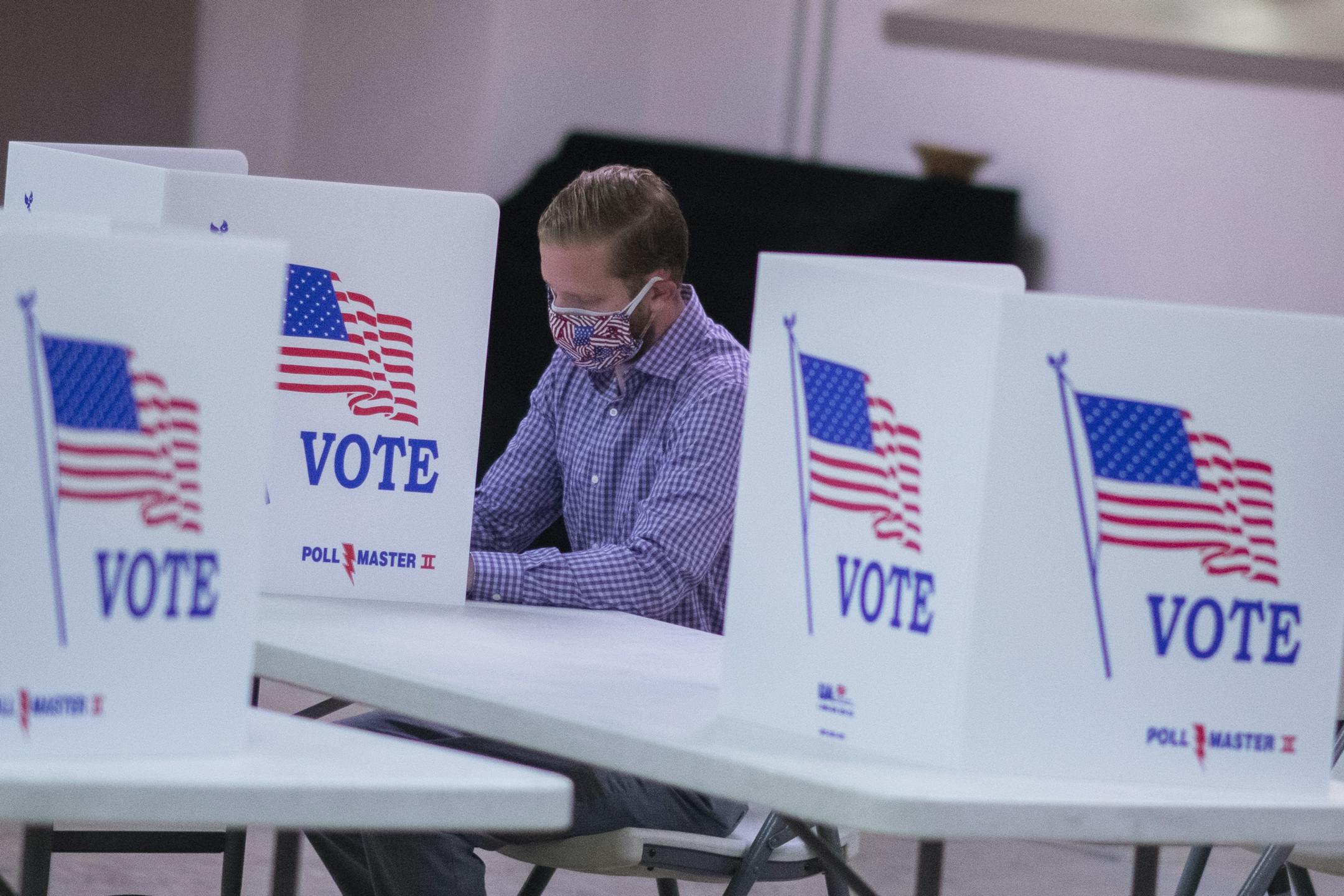 QUAKERTOWN, PA. -- BC-OPED-COATS-ELECTION-INTEGRITY-ART-NYTSF -- A man votes at a polling station in Quakertown, Pa., June 2, 2020. Trump's former director of national intelligence on how to firmly and unambiguously reassure all Americans that their votes will be counted. (Mark Makela/The New York Times) ONLY FOR USE WITH ARTICLE SLUGGED — BC-OPED-COATS-ELECTION-INTEGRITY-ART-NYTSF — OTHER USE PROHIBITED