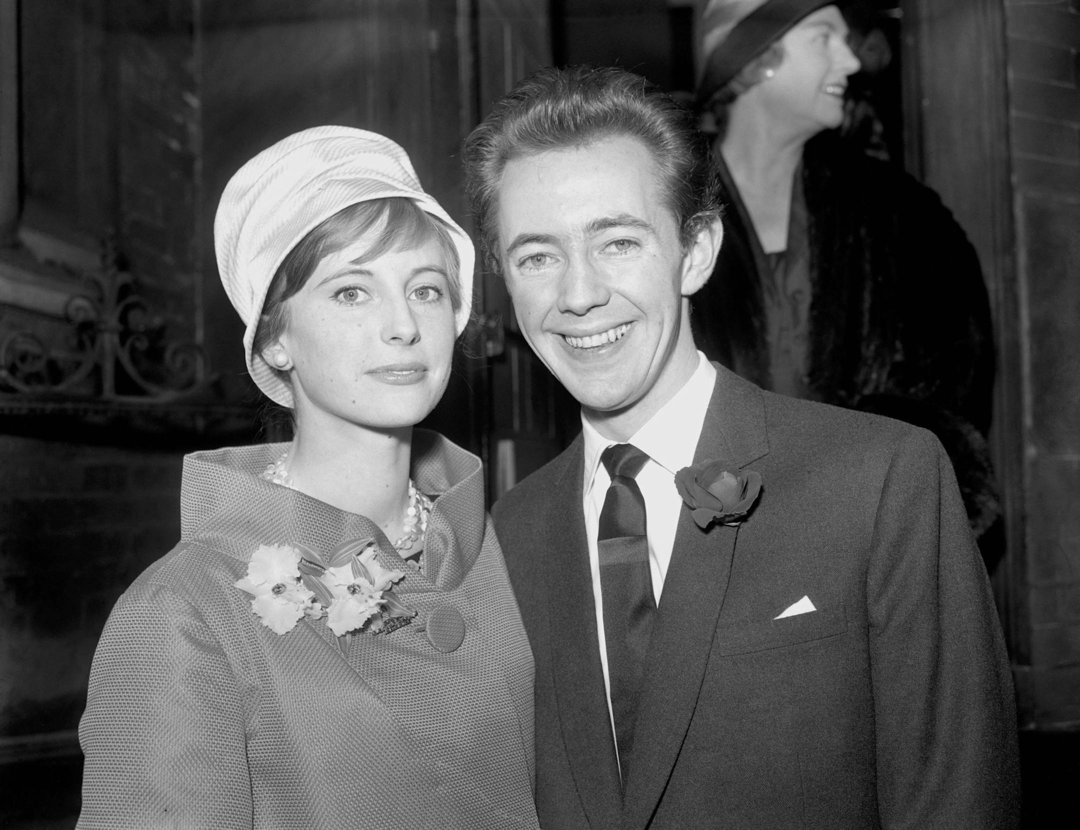 FILE - This is a March 22, 1959 file photo of British actor and musician Noel Harrison, and his bride, Sara Tufnell, at the register office after their wedding at Caxton Hall, Westminster, London. Noel Harrison, who sang the Academy Award-winning ballad "The Windmills of Your Mind," has died at 79. Harrison's current wife, Lori Chapman, said Tuesday Oct. 22, 2013 that he suffered a heart attack after a performance on Saturday in Devon, southwest England, and died later in a hospital. (AP Photo/P