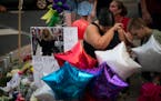 Miranda Ramirez cried during a prayer for her close friend America M. Thayer, as friends gathered for a balloon release where she was killed in Shakop