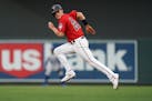 Minnesota Twins right fielder Max Kepler (26) raced from first base as he attempted to steal second base in the first inning.