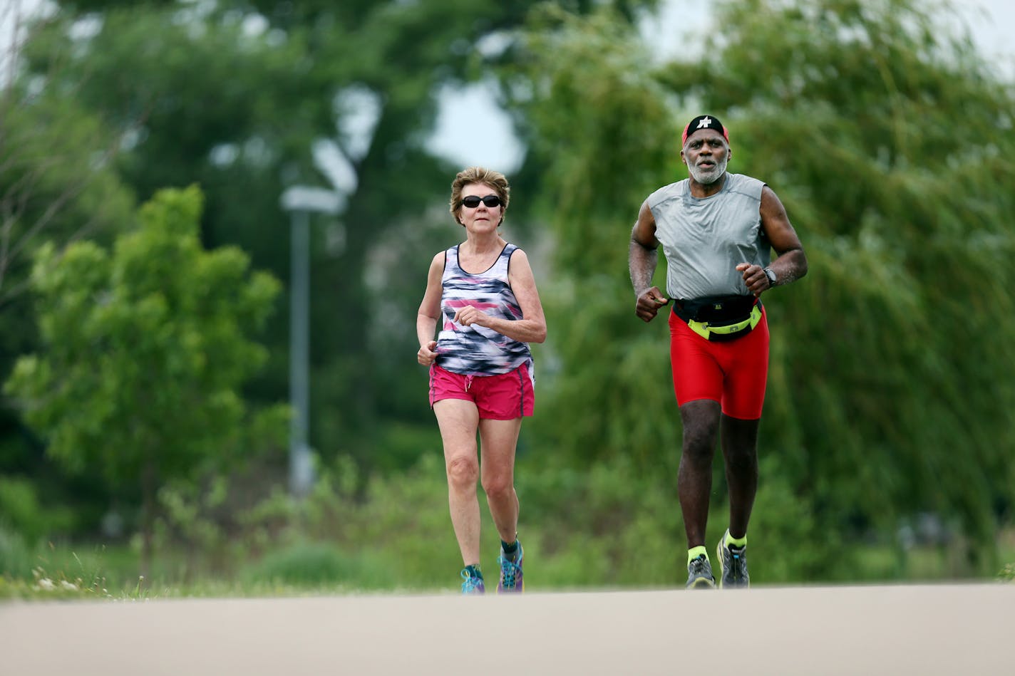 Minnesota Supreme Court Associate Justice Alan Page and his wife Diane Page took a recent 6 am run around Lake of Isle in Minneapolis, MN. Justice Page will hit the mandatory retirement age of 70 in August. ] Jerry Holt/ Jerry.Holt@Startribune.com