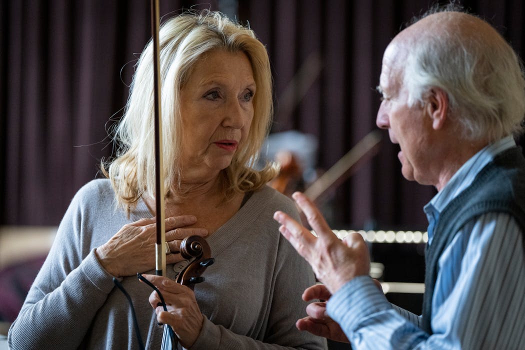 Concertmaster Julia Persitz, left, talks with artistic director Jay Fishman before Minnesota Sinfonia rehearsal in St. Paul on Nov. 6.