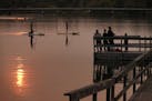 Many of the Twin Cities public docks and piers are popular places for fishing and access to the chain of lakes. Marilyn Griffin and Don Anthony took t
