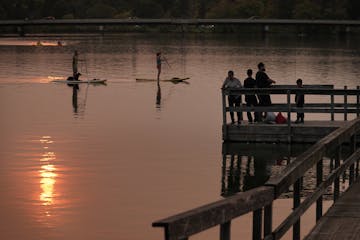 Many of the Twin Cities public docks and piers are popular places for fishing and access to the chain of lakes. Marilyn Griffin and Don Anthony took t