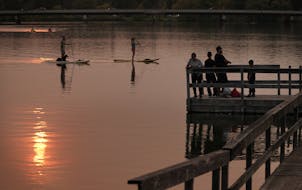 Many of the Twin Cities public docks and piers are popular places for fishing and access to the chain of lakes. Marilyn Griffin and Don Anthony took t