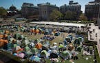 Pro-Palestinian protesters camp on a lawn at Columbia University in New York, Monday morning, April 22, 2024. Columbia University announced early Mond