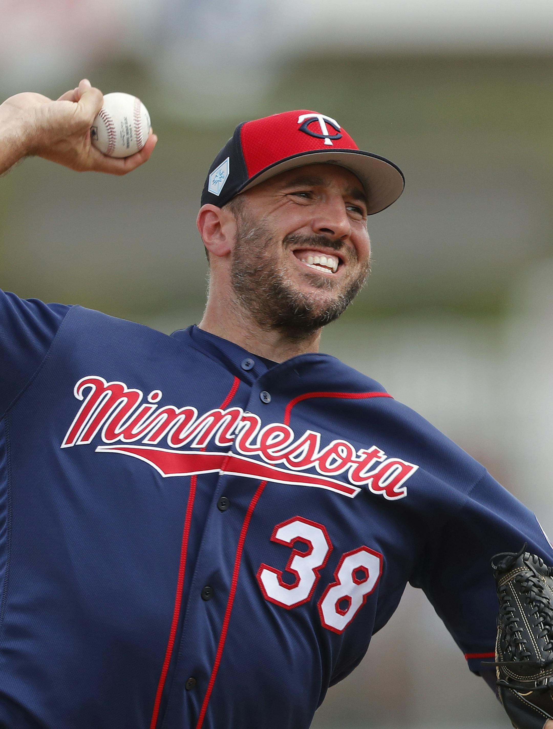 Minnesota Twins relief pitcher Blake Parker (38) works against the Boston Red Sox in the fifth inning of a spring training baseball game Wednesday, March 13, 2019, in Fort Myers, Fla. (AP Photo/John Bazemore)