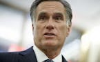 FILE - In this Tuesday, Nov. 29, 2016 file photo, former Republican presidential nominee Mitt Romney talks with reporters in New York. Romney said on 