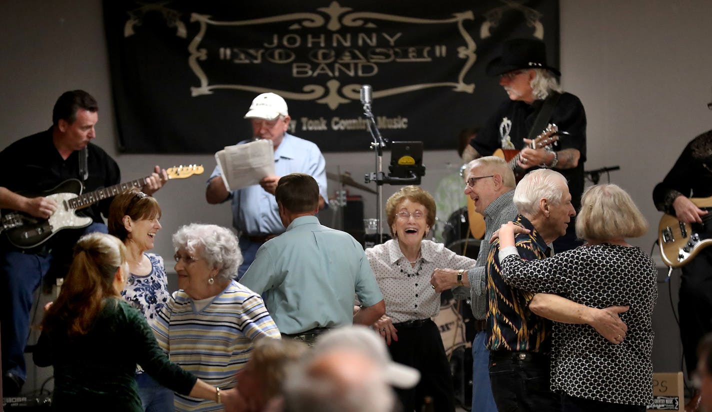 Country singer/yodeler Darrel Johnson, 82, takes to the stage weekly for a few songs, along side the Johnny "No Cash" Band at the Red Barn VFW Post 8752 in Cottage Grove, where he practices the lost art of the yodel, always to the delight of the mostly senior crowd. Here, dancers pack the floor as Johnson performs Tuesday, May 8, 2018, at the Red Barn VFW in Cottage Grove, MN.] DAVID JOLES &#xef; david.joles@startribune.com Each week, after partaking in the weekly meat raffle, singer/yodeler Dar