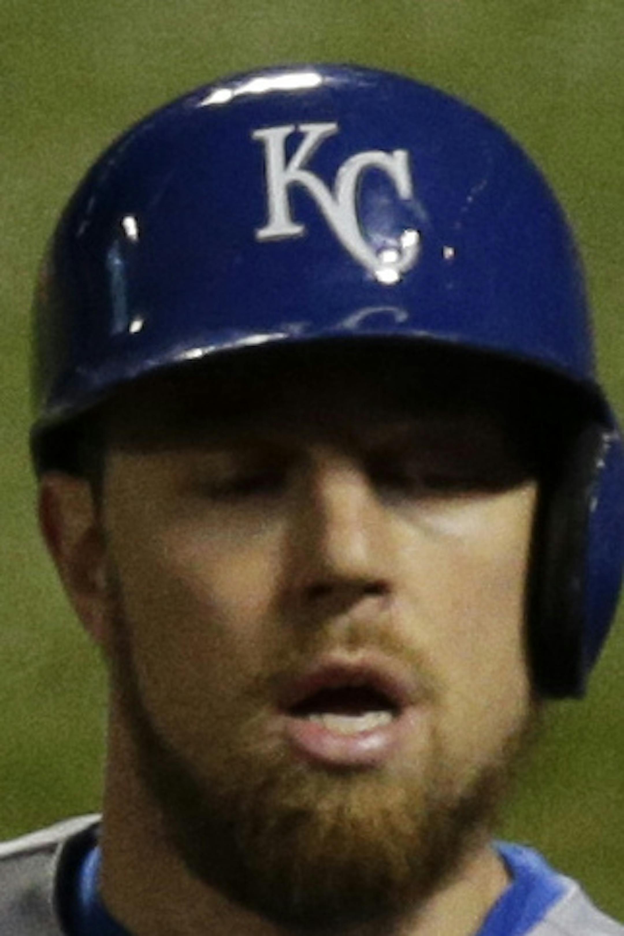 Kansas City Royals' Ben Zobrist is congrtulated by Mike Moustakas (8) after scoring on an RBI single by Kansas City Royals' Lorenzo Cain during the sixth inning of Game 4 of the Major League Baseball World Series against the New York Mets Saturday, Oct. 31, 2015, in New York. (AP Photo/Julie Jacobson)