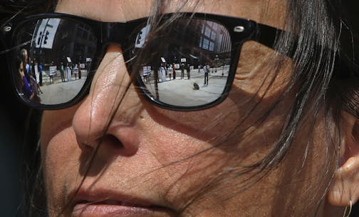 The Minnesota Public Utilities Commission met to consider alternative routes on the proposed Sandpiper pipeline across northern Minnesota to carry Bakken oilThursday, Aug. 7, 2014, in St. Paul. Here, anti-pipeline activists are reflected n the glasses of Winona LaDuke, an Anishinaabe environmentalist and activist, during a rally outside before the start of the commission meeting.] (DAVID JOLES/STARTRIBUNE) djoles@startribune The Minnesota Public Utilities Commission met to consider alternative r