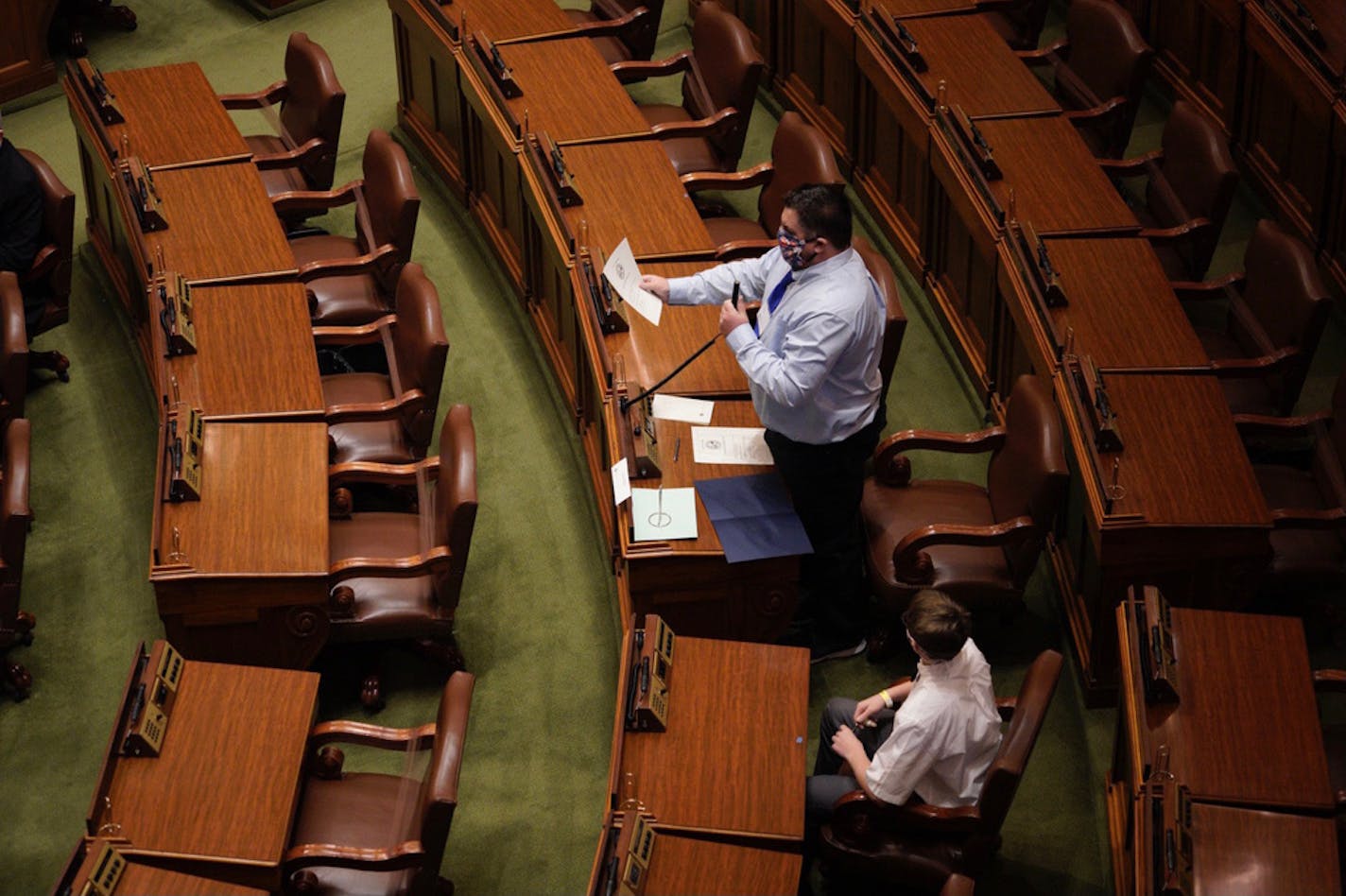 Elector Joel Heller castes his vote for Joe Biden and Kamala Harris on Monday at noon at the Minnesota State Capitol.