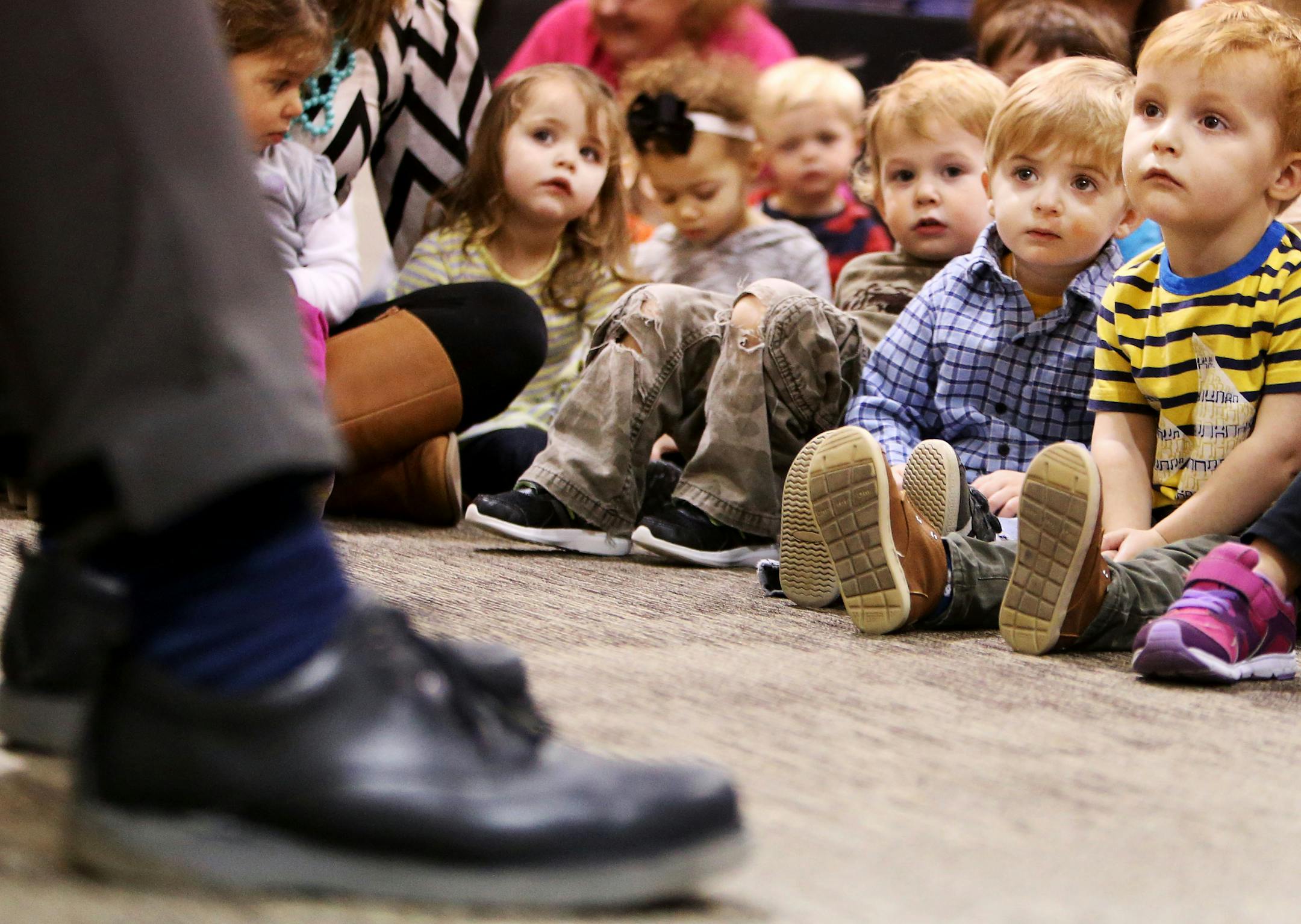 Preschoolers listened as Alan Page, a retired Minnesota Supreme Court Justice and Pro Football Hall of Fame inductee, read to them the book he wrote entitled "Alan and His Perfectly Pointy impossibly Perpendicular Pinky."