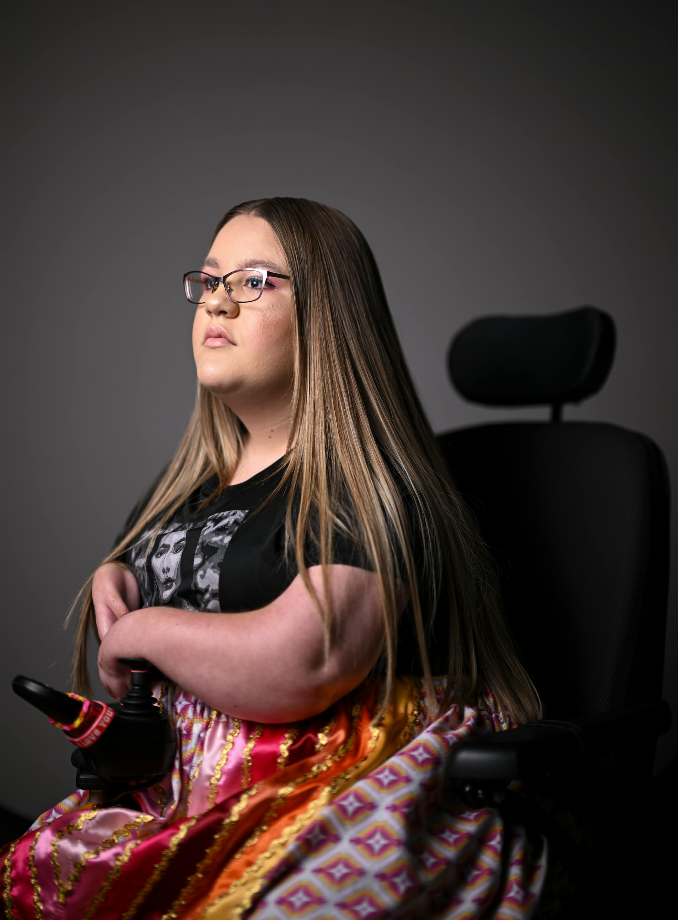 Taylor O'Shea, 15, a student from Deer River High School on the Leech Lake Reservation, sits for a portrait during "Northern Lights: A Native Nations Fashion Night." O'Shea is part of the Anishinaabe Education Leadership Group and worked on designing and producing apparel with artist Delina White of "IamAnishinaabe."