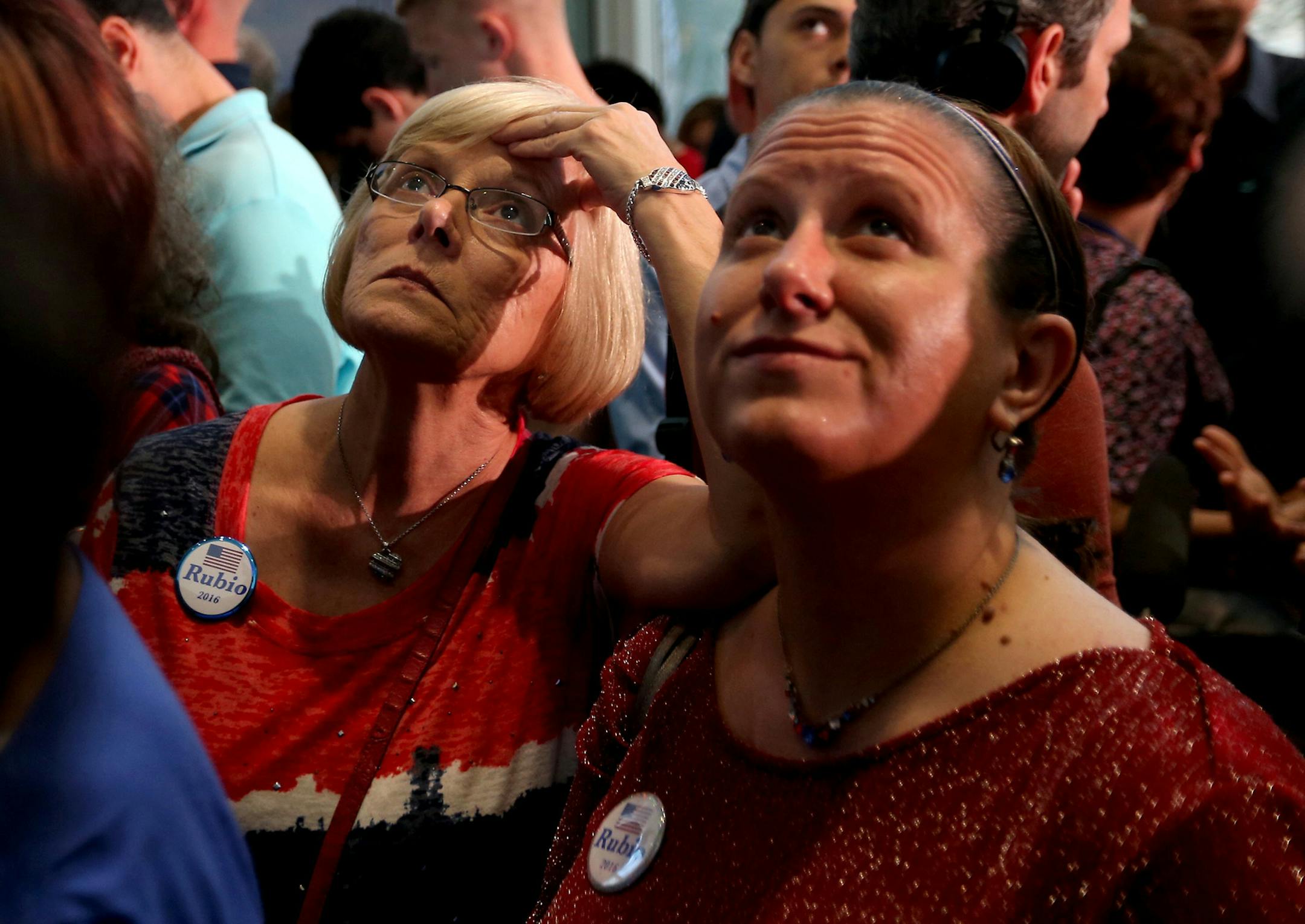 Gail Bedell and her daughter, Aimee Peters, join supporters of GOP presidential candidate Marco Rubio awaiting results from the Florida primary, at Florida International University's Arena in Miami, on Tuesday, March 15, 2016. (Patrick Farrell/Miami Herald/TNS) ORG XMIT: 1182012