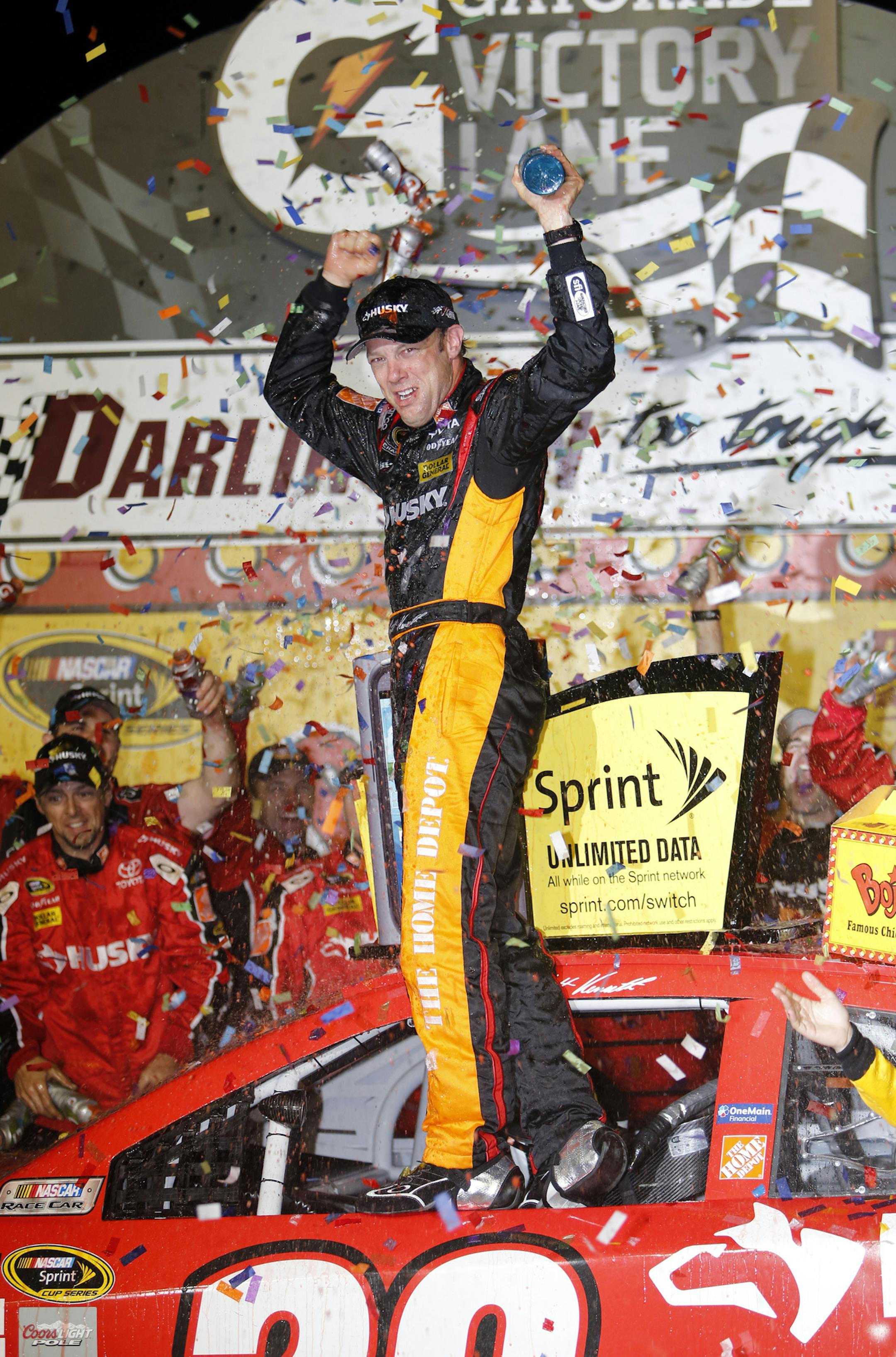Matt Kenseth celebrates in Victory Lane after winning the NASCAR Sprint Cup series auto race at Darlington Raceway, Saturday, May 11, 2013, in Darlington, S.C. †(AP Photo/Mic Smith)
