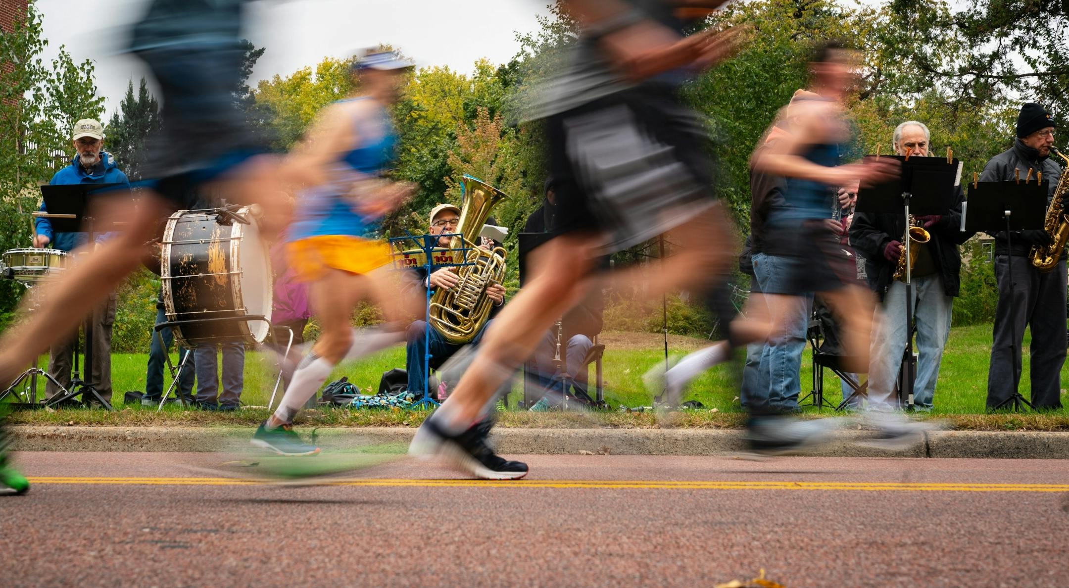 The Seward Concert Band played along West River Parkway between 17 and 18 mile marker during the Twin Cities Marathon.