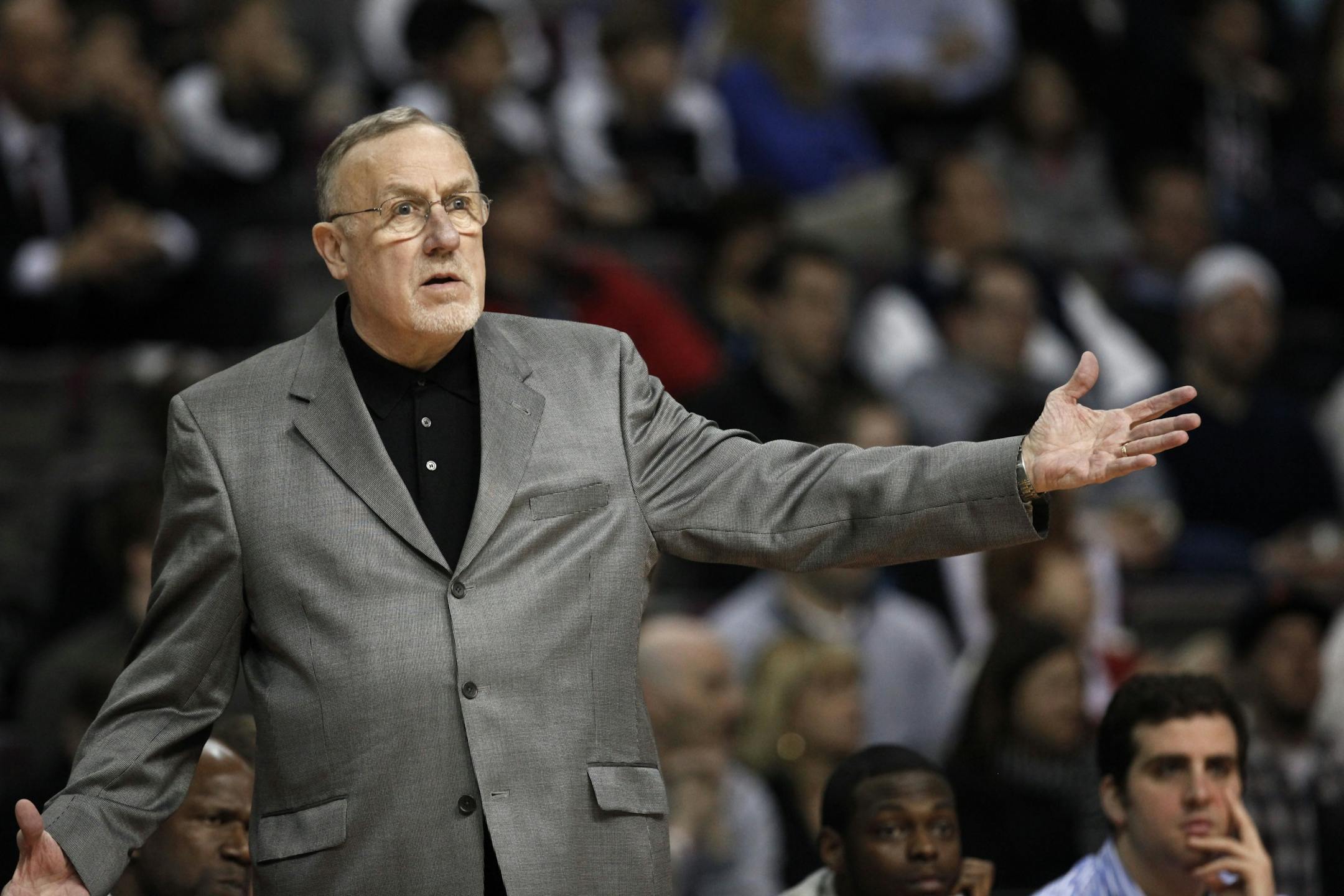 Minnesota Timberwolves head coach Rick Adelman questions a call against the Detroit Pistons.