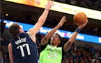Dallas forward Luka Doncic tries to defend against a shot by Timberwolves guard Jarrett Culver on Wednesday.