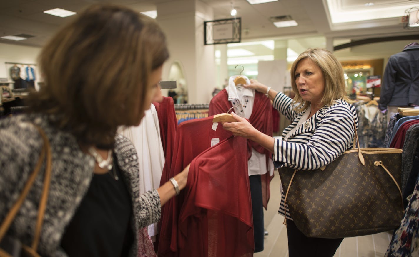 Christopher & Banks CEO LuAnn Via, on right, discusses customer likes and dislikes with Monica Dahl, senior V.P. for marketing while visiting the Christopher & Banks store at the Mall of America. ] Christopher & Banks CEO LuAnn Via shows us around the retailer's newly-redesigned Mall of America store. The retailer, which is still in the midst of a turnaround, is putting all of its brands under one roof, including its plus-sizes. 237660 Christopher 20035789A (DAVID BREWSTER/STAR TRIBUNE)