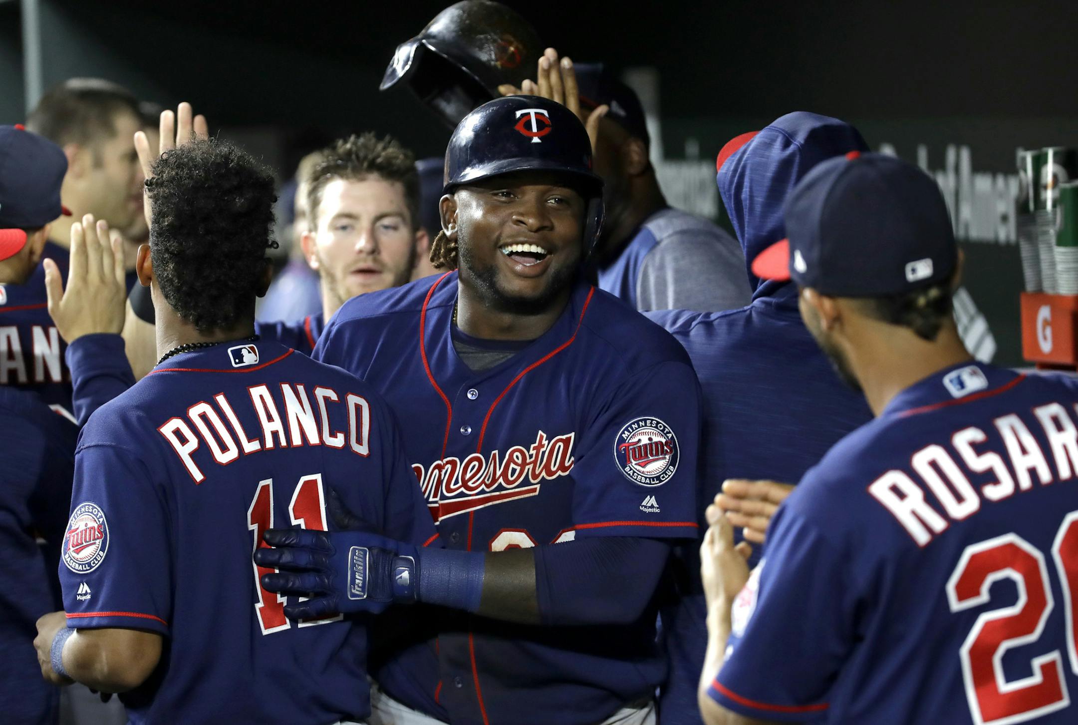 Miguel Sano flashed a big smile while celebrating his two-run homer with teammates in the ninth inning.