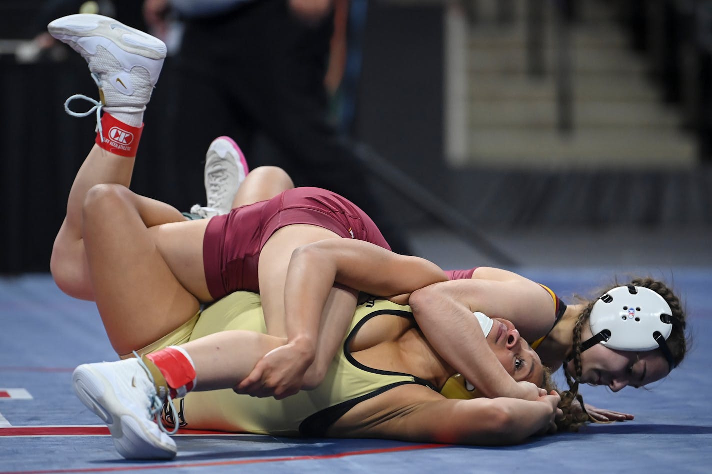 Forest Lake's Aspen Blasko tries to pin Fridley's Olivia Sackor in the 107lb final bout during the Minnesota State High School girls Wrestling Championships Saturday, March 5, 2022 at Xcel Energy Center in St. Paul, Minn. Blasko pinned Sackor for the win. ] AARON LAVINSKY • aaron.lavinsky@startribune.com