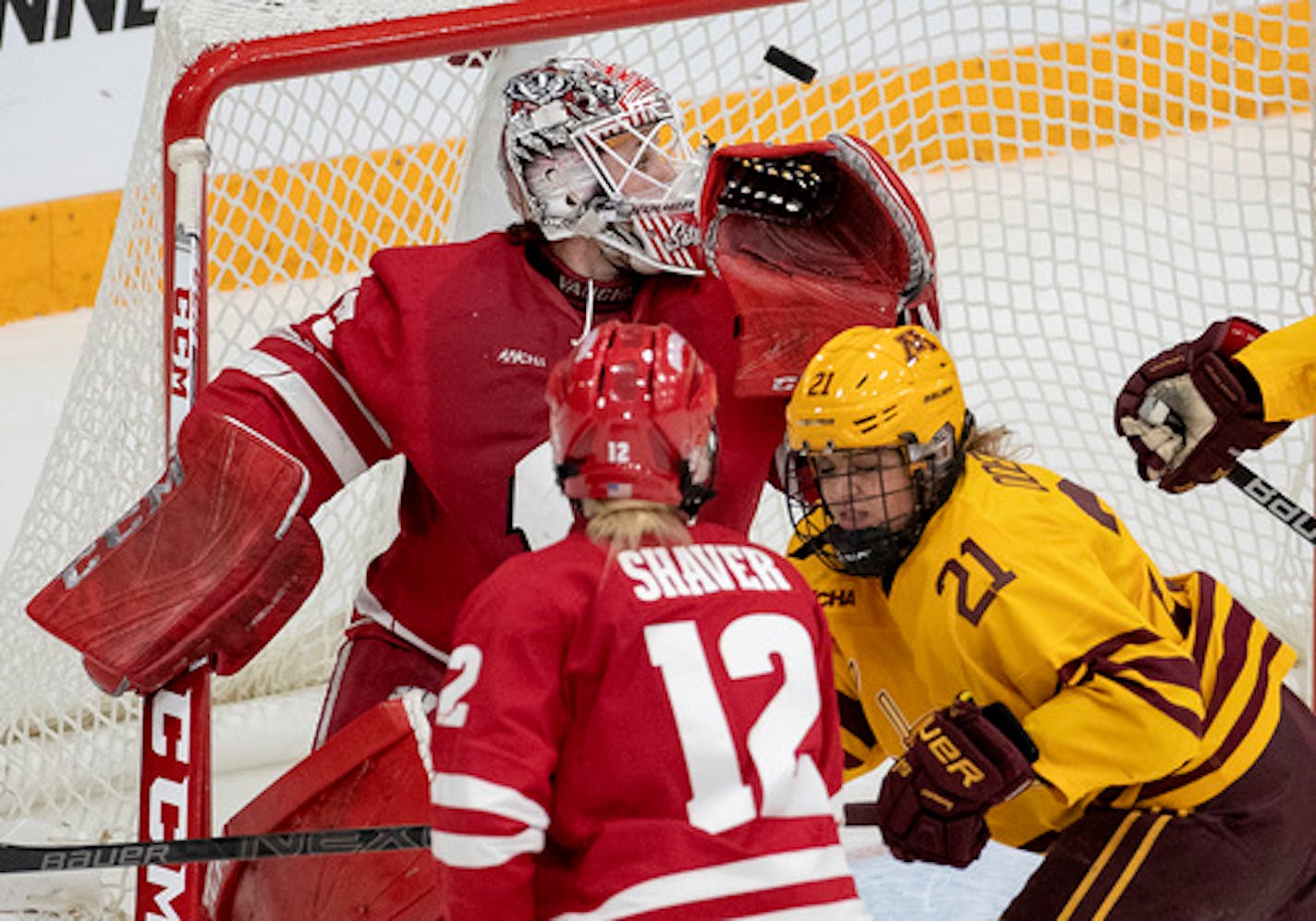 Grace Zumwinkle (12) shot the puck past Wisconsin goalie Kristen Campbell (35) for a goal in the second period.