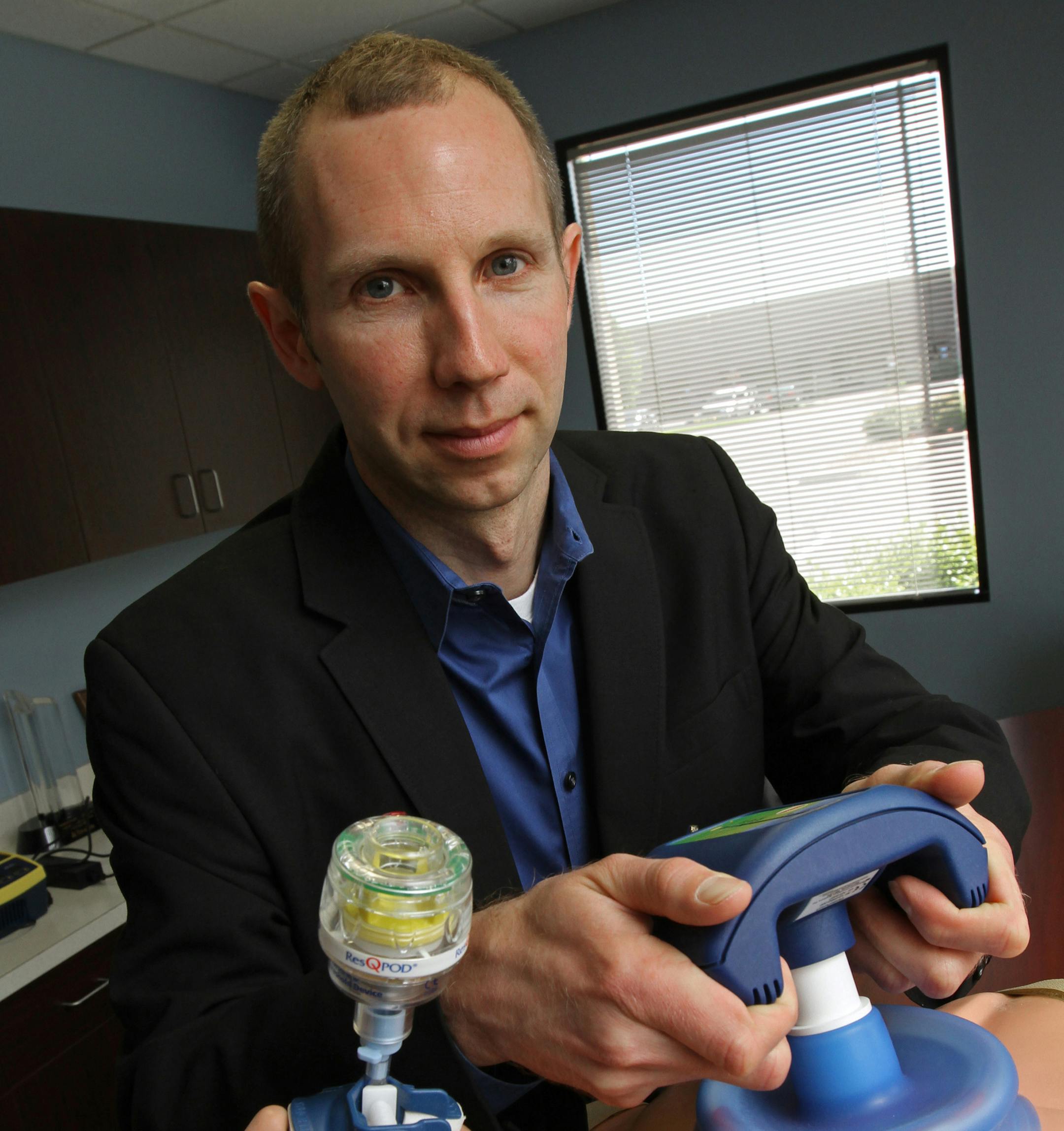 Mike Black, CEO of Advanced Circulatory Systems of Roseville, demonstrated the ResQPump and the ResQPOD, two non-invasive circulatory enhancement products used by medical professionals. Black was photographed on 5/9/12 at the Roseville headquarters.] Bruce Bisping/Star Tribune bbisping@startribune.com Mike Black/source. ORG XMIT: MIN2013091916272860