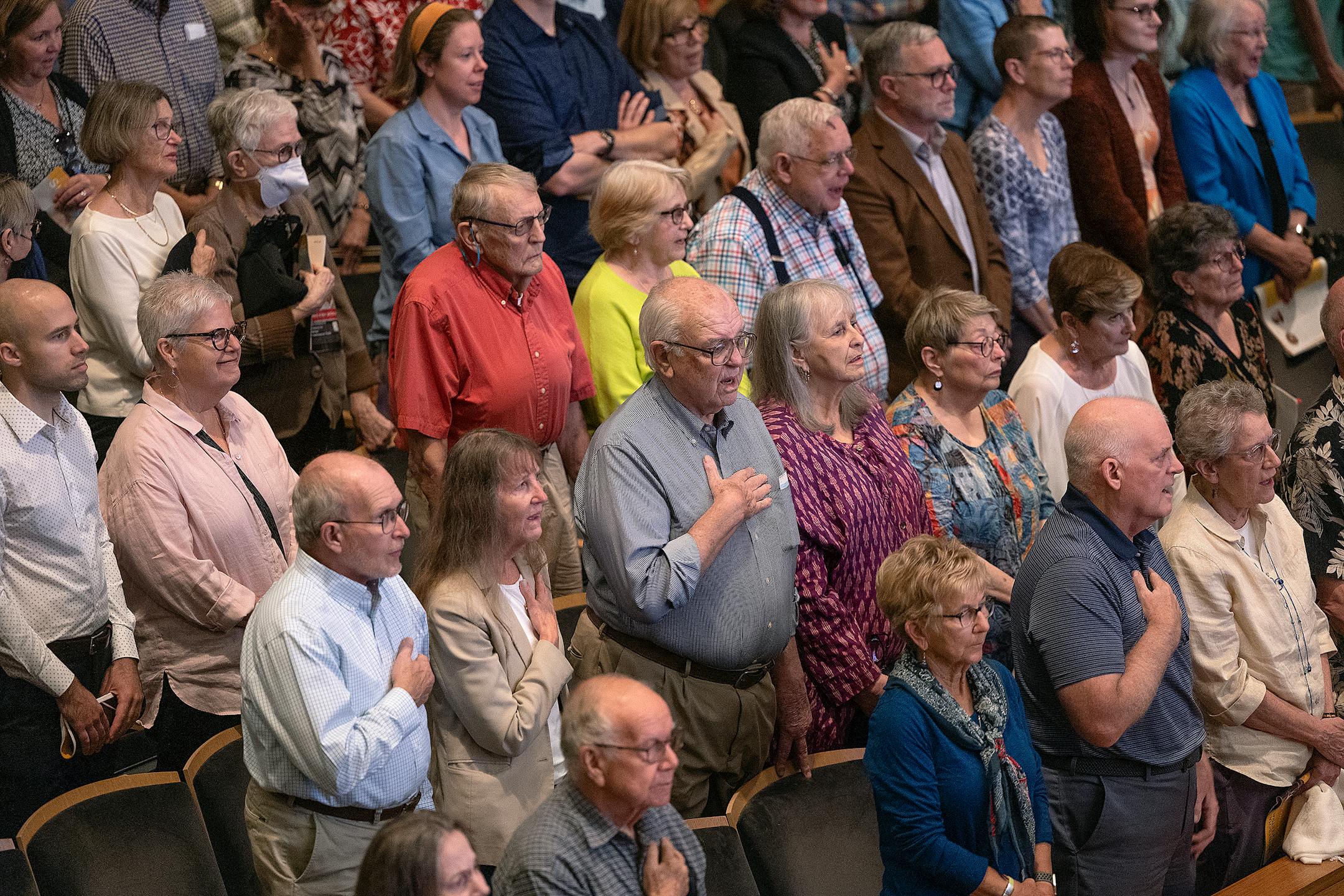 The orchestra crowd stood for the National Anthem as Thomas Søndergård took to the stage during his first concert as music director of the Minnesota Orchestra in Minneapolis.