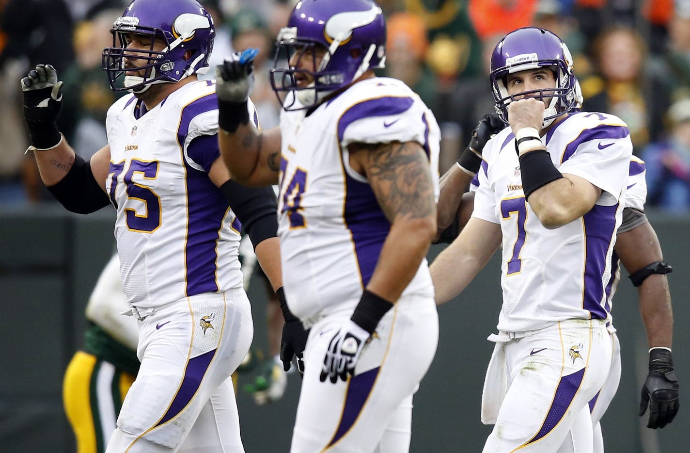 Christian Ponder (7) and the Vikings offense walked off the field after Morgan Burnett (42) intercepted a pass intended for Kyle Rudolph in the third quarter.