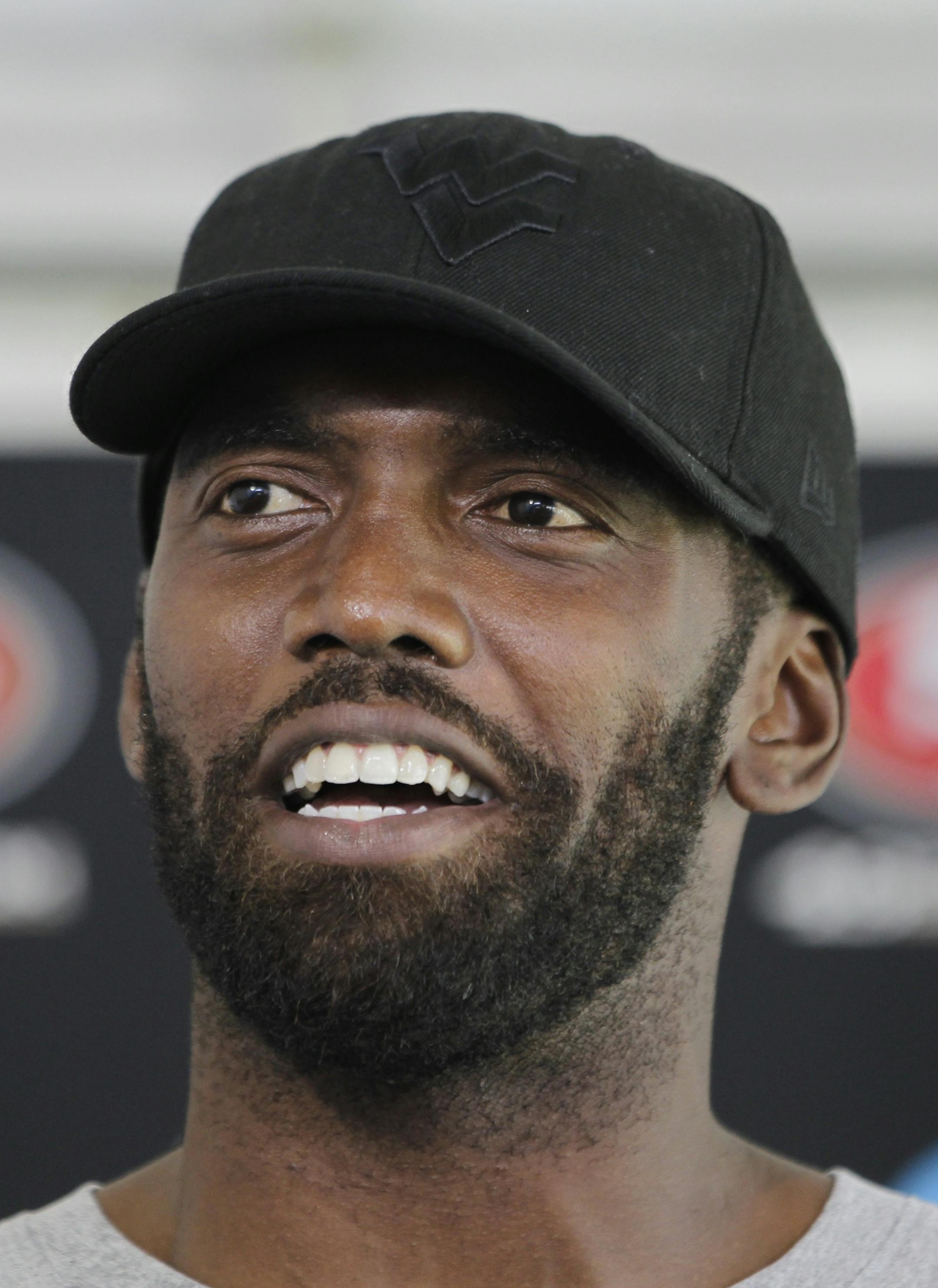 San Francisco 49ers wide receiver Randy Moss smiles during a news conference at NFL football headquarters in Santa Clara, Calif., Friday, July 27, 2012. (AP Photo/Paul Sakuma) ORG XMIT: MIN2013012116114722 ORG XMIT: MIN1308192047074437