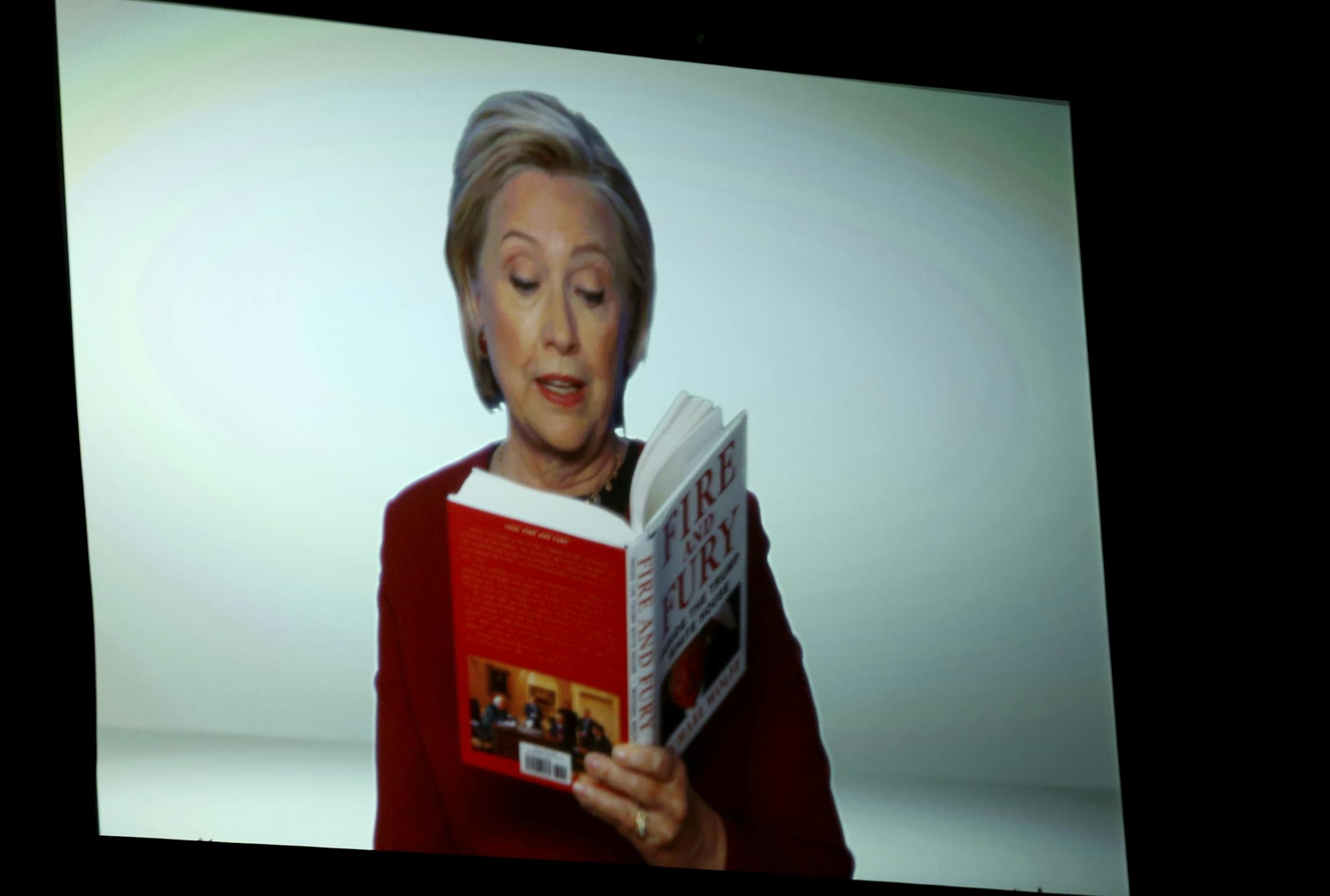 Hillary Clinton appears on screen reading an excerpt from the book "Fire and Fury" during a skit at the 60th annual Grammy Awards at Madison Square Garden on Sunday, Jan. 28, 2018, in New York. (Photo by Matt Sayles/Invision/AP)