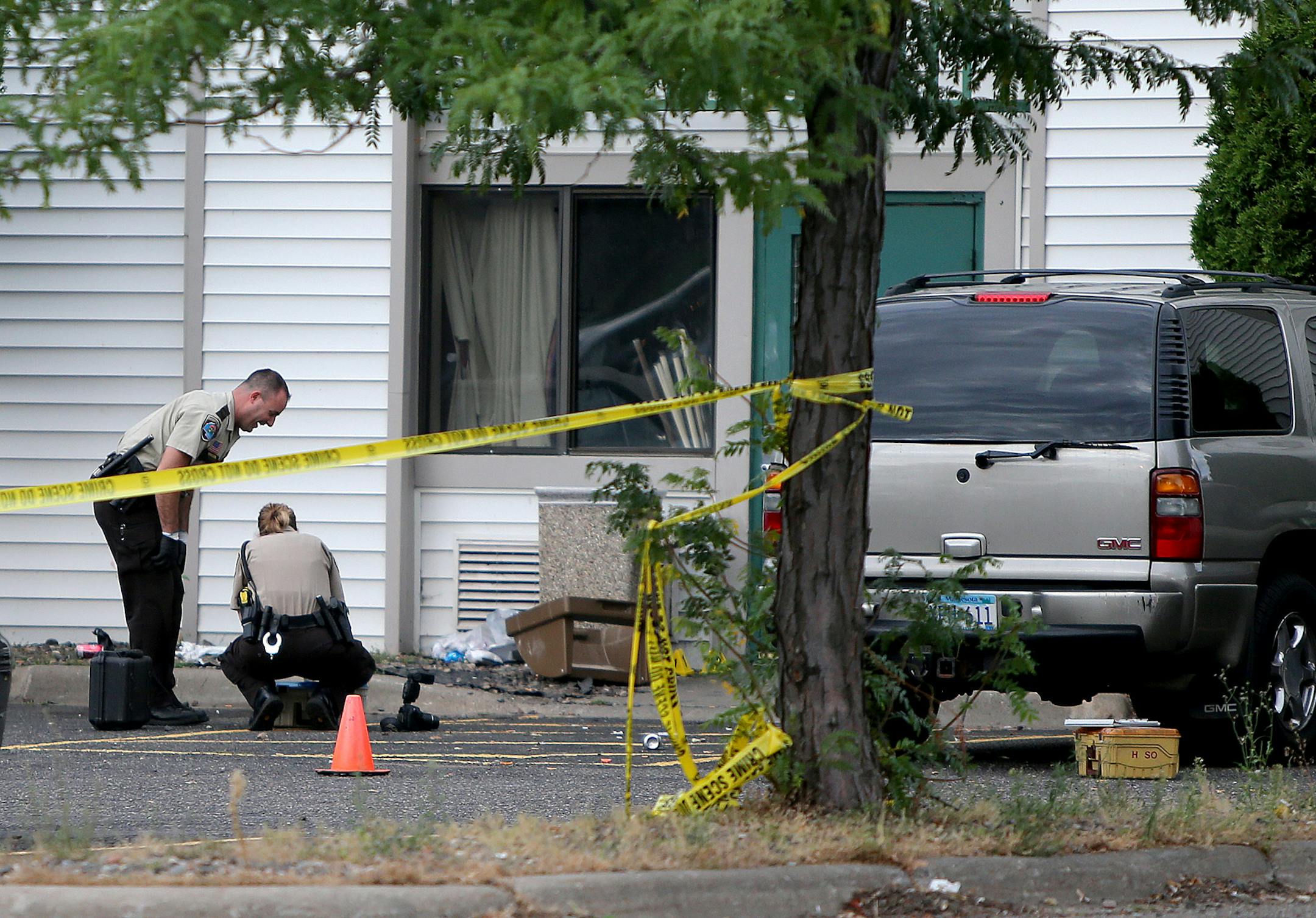 Police investigated a crime scene that spanned a Denny's Restaurant, Days Inn & Suites Hotel, and a Super 8, early Thursday, August 22, 2013 in Brooklyn Center, MN. (ELIZABETH FLORES/STAR TRIBUNE) ELIZABETH FLORES &#x2022; eflores@startribune.com