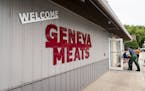 Geneva Meats owner Paul Smith brings his cart back in to pick up boxes of halal meat to bring out to a delivery truck.
