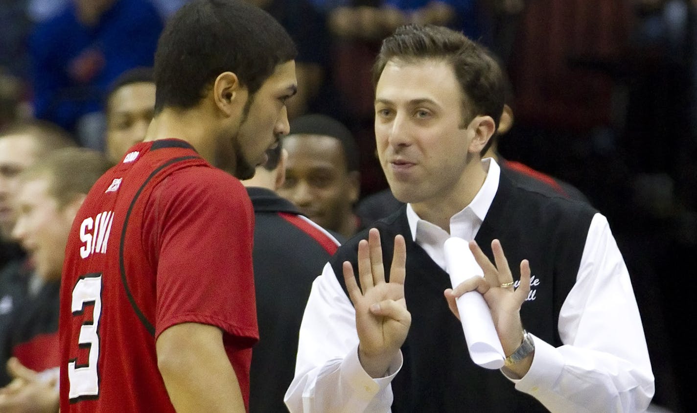 January 28, 2012: Louisville Cardinals associate coach Richard Pitino talks things over with guard Peyton Siva (3) during the NCAA basketball game between the #25 Louisville Cardinals and the Seton Hall Pirates at the Prudential Center in Newark, New Jersey. Louisville beat Seton Hall, 60-51. (Cal Sport Media via AP Images) ORG XMIT: CSMAP