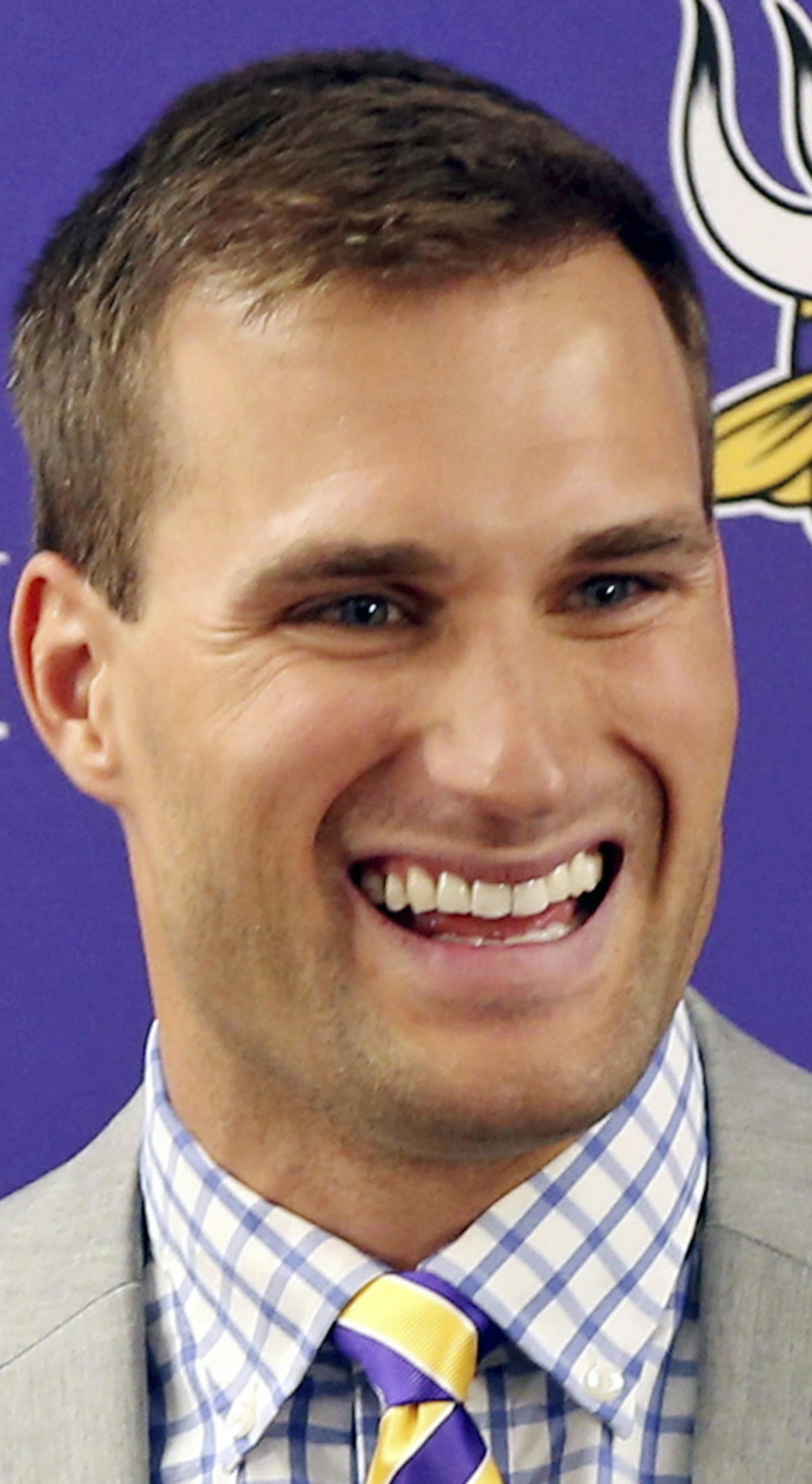 Minnesota Vikings new quarterback Kirk Cousins addresses the media after he was introduced during a news conference, after signing a three-year, $84 million contract, at the NFL football team's new headquarters Thursday, March 15, 2018, in Eagan, Minn. (AP Photo/Jim Mone)