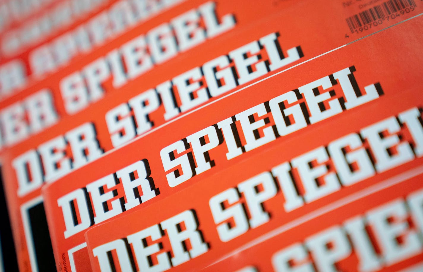 The Dec. 19, 2018 photo shows issues of German news magazine Spiegel arranged on a table in Berlin. An award-winning journalist who worked for Der Spiegel, one of Germany's leading news outlet, has left the publication after being found to have committing what the weekly described Wednesday as journalistic fraud "on a grand scale" over a number of years. (Kay Nietfeld/dpa via AP)