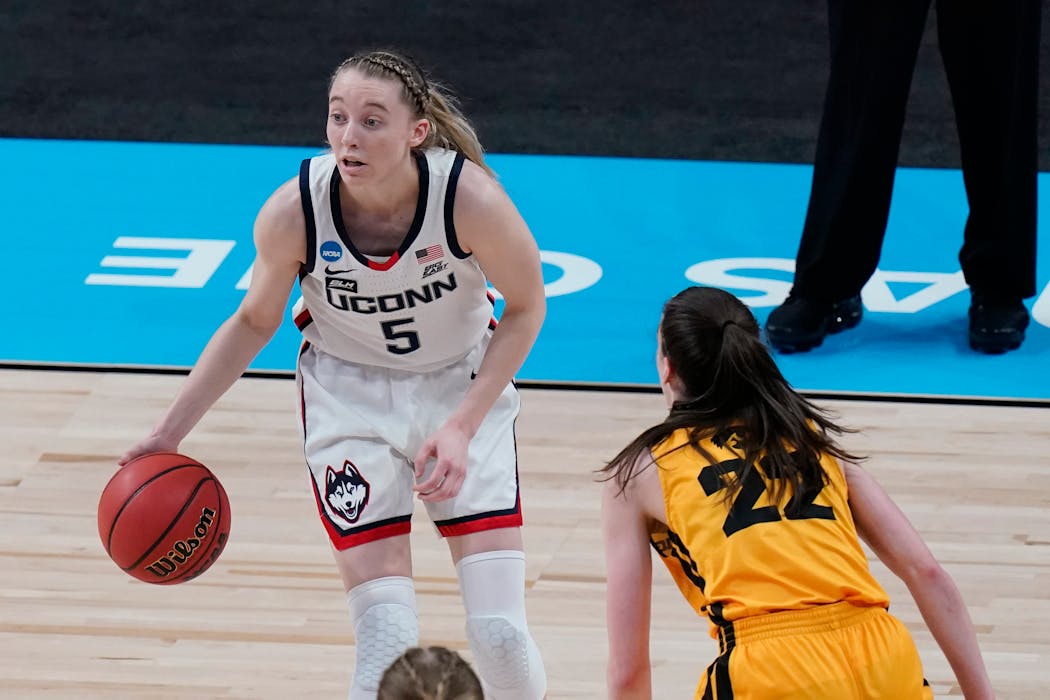 UConn's Paige Bueckers handled the ball against Iowa's Caitlin Clark during a Sweet 16 game in San Antonio in 2021.