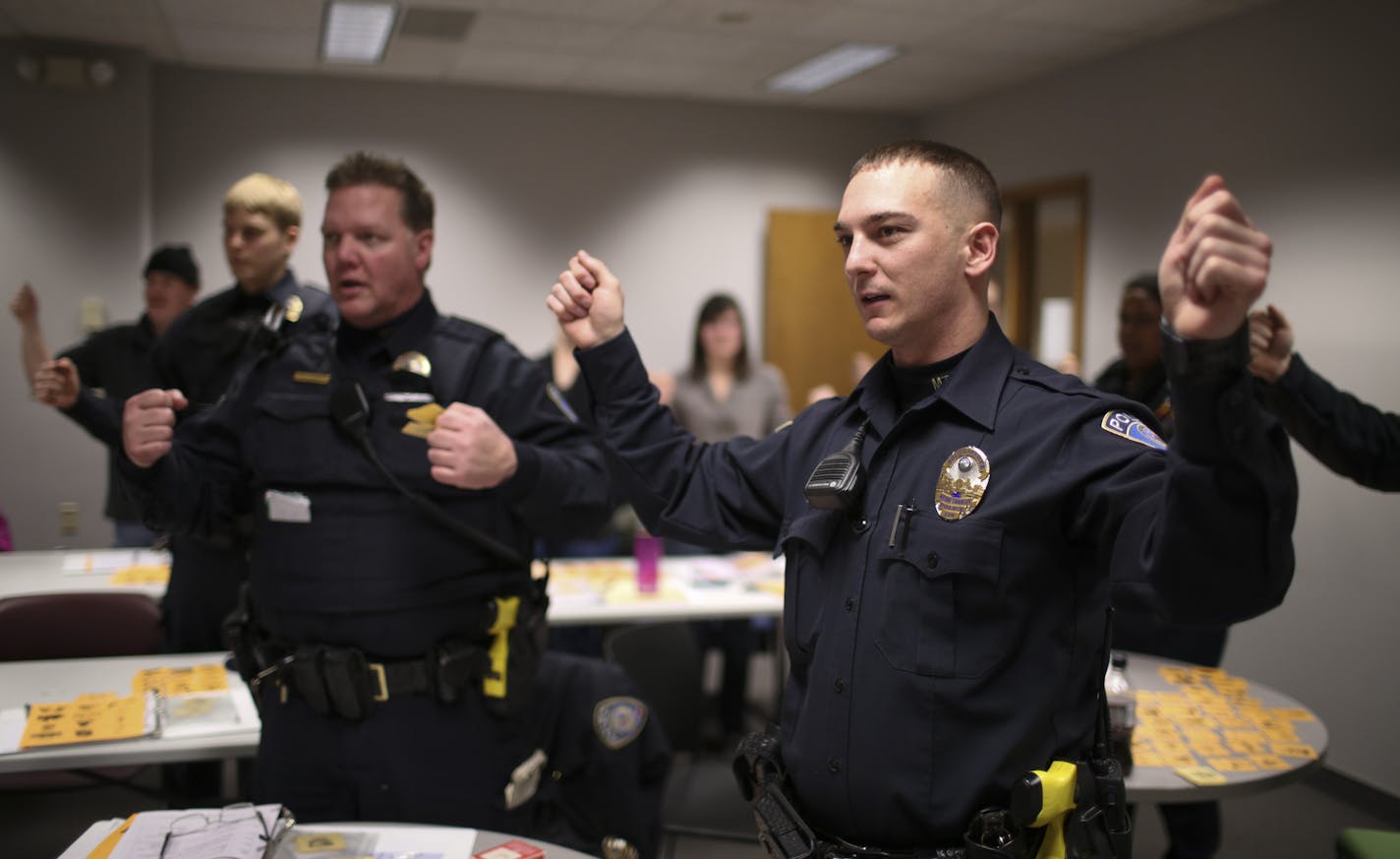 Officers Justin Johnson, foreground, and Darryl Loken pantomimed opening a window as instructor LeAnn Taylor spoke the Spanish phrase for doing so Wednesday night at a Metro Transit's office in St. Paul. ] JEFF WHEELER &#x201a;&#xc4;&#xa2; jeff.wheeler@startribune.com Metro Transit police officers are encountering more and more Spanish speakers as they make their rounds and respond to calls. The problem is few officers speak the language. Now some are taking Spanish lessons to help them better s