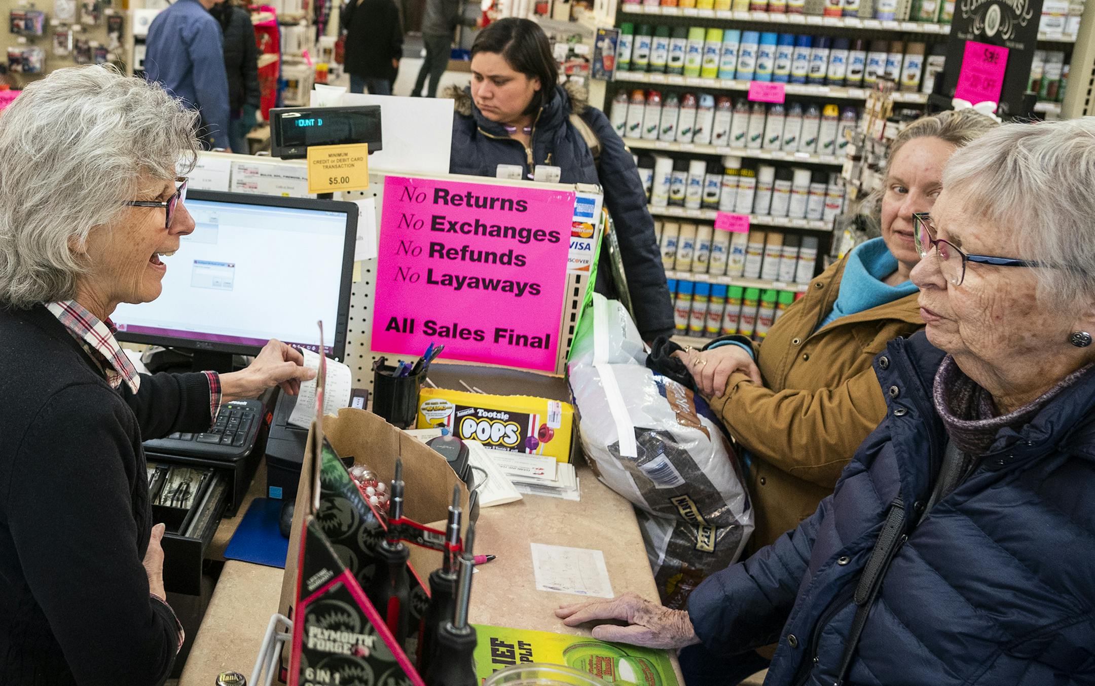 Co-owner Jan Gildner rang up customers during the store-closing liquidation sale at Hamline Hardware Hank.