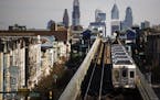 In this Wednesday, Oct. 26, 2016 photo, a train moves along the Market-Frankford Line in Philadelphia. Philadelphia�s transit strike ended Monday, N