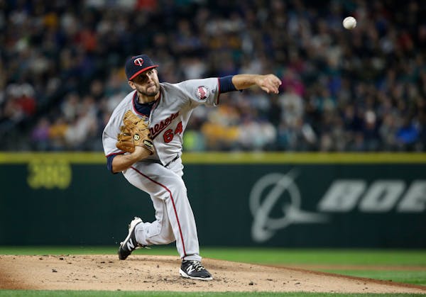 Minnesota Twins starting pitcher Pat Dean in action against the Seattle Mariners in a baseball game Friday, May 27, 2016, in Seattle. (AP Photo/Elaine