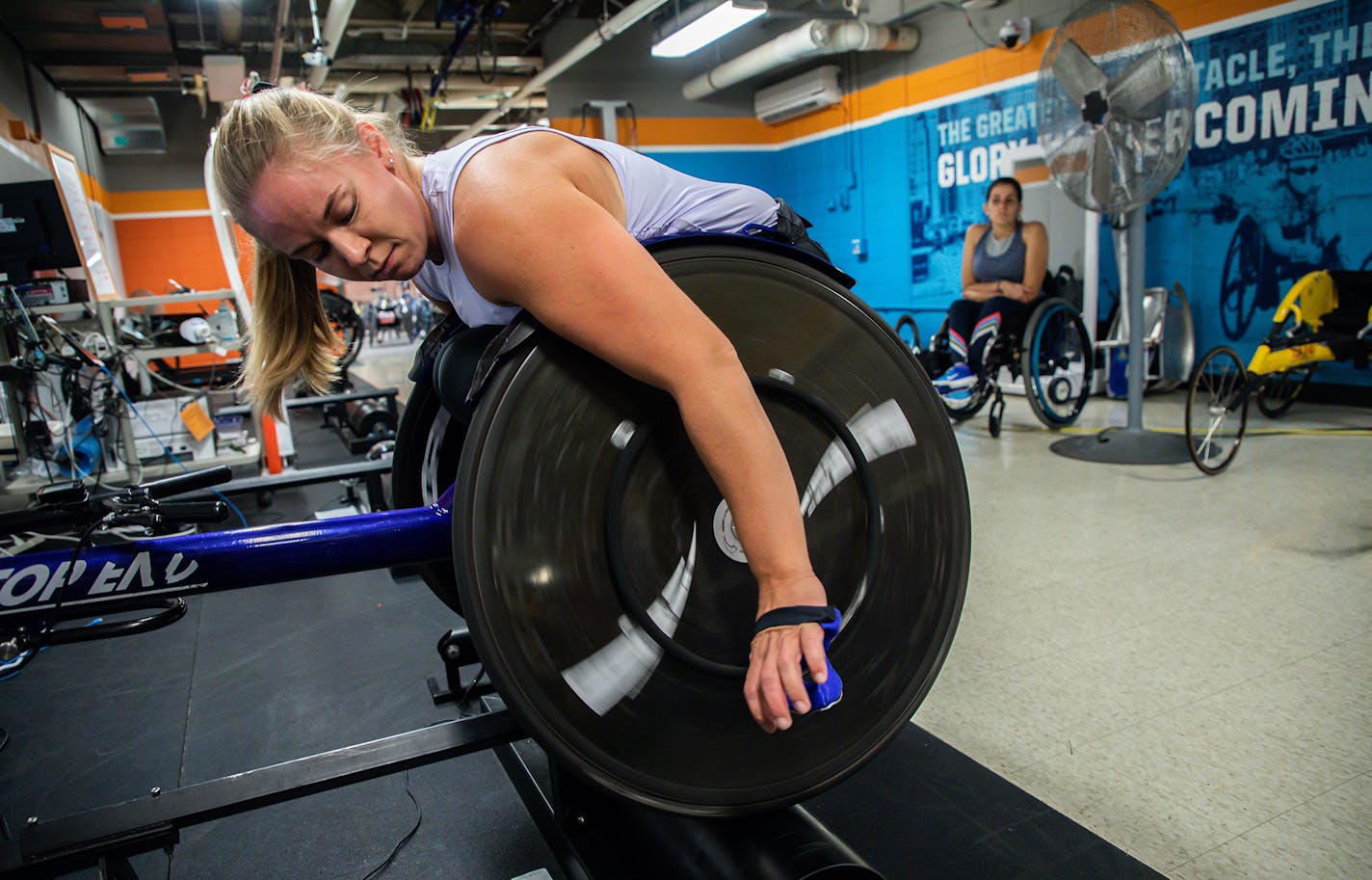 Arielle Rausin, founder of Ingenium Manufacturing, uses her custom wheelchair racing gloves during practice at the National Training Center for Wheelchair Track at the University of Illinois in Champaign, Ill., on October 3, 2019. (Zbigniew Bzdak/Chicago Tribune/TNS) ORG XMIT: 1456142